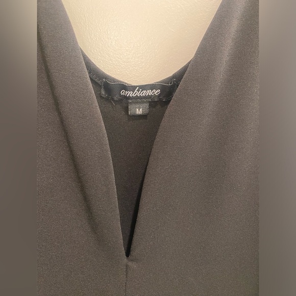 Black jumpsuit with pockets. Tapered leg at bottom. Size M. Super cute! - Picture 2 of 3